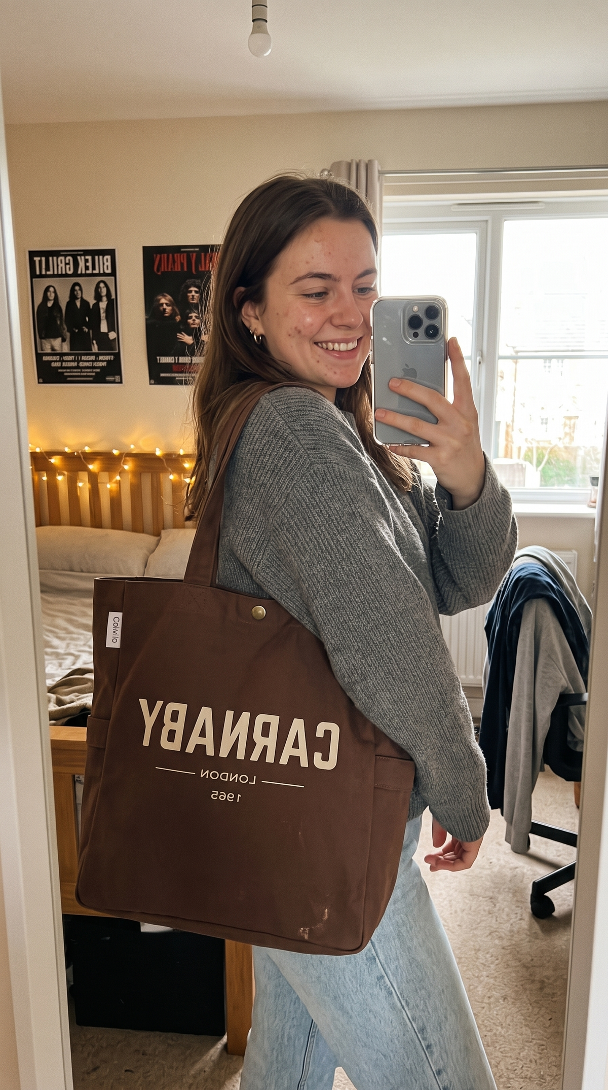 Customer carrying the CARNABY LONDON 1965 brown canvas tote bag on her shoulder