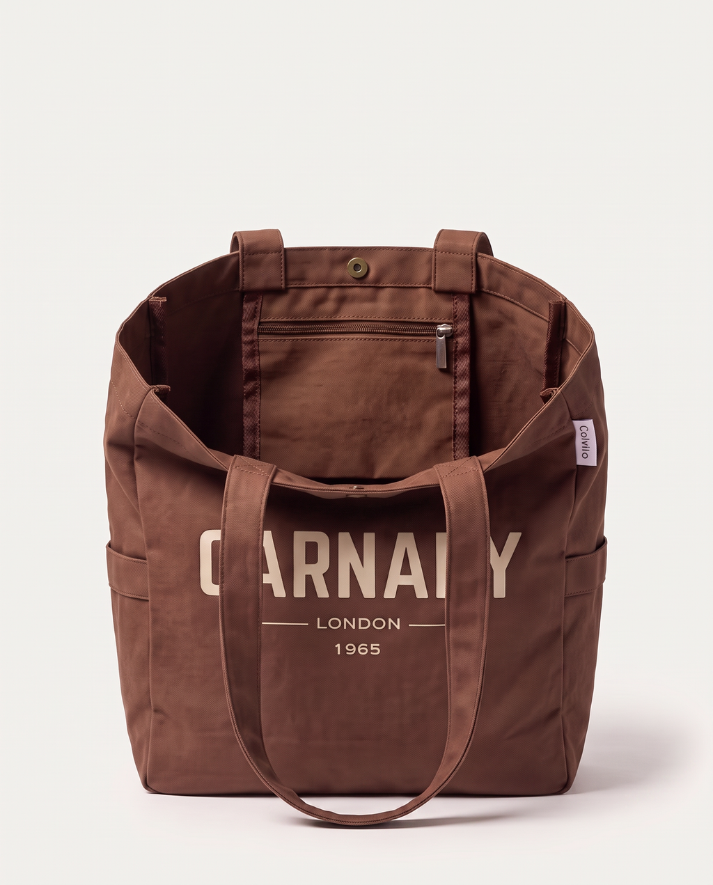 Inside the CARNABY LONDON 1965 tote bag, showing the interior zip pocket and dual carry handles